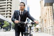 © Sergey Nivens - Young businessmen with a bike