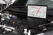 © tool51 - Professional car mechanic working in auto repair service by system computer