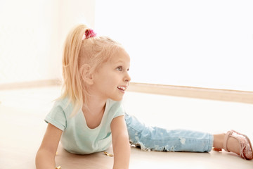 Wall Mural - Cute little girl playing at party