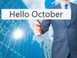 Hello October - Businessman hand holding sign