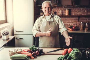 Wall Mural - Old man in kitchen