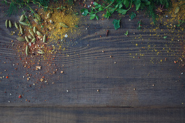 Wall Mural - Mix of fresh herbs and spices assortment on wooden background.