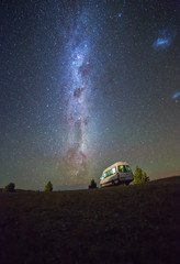 Milky way over camper van and night sky at south island New Zealand