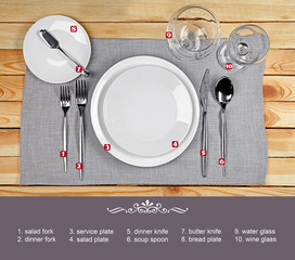 Wall Mural - Beautiful table setting with white plates on wooden table