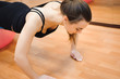 © nagaets - happy cutie athletic girl , execute exercise and smile, in sport-hall