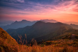 Fototapeta Na ścianę - Sunset scene with the peak of mountain and cloudscape at Phu chi fa in Chiang rai, Thailand