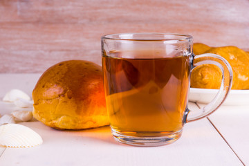 glass of tea, fresh pastries, croissants on a table in a southern spa cafe. Light spa breakfast