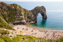 British Seaside - Summer Holiday Destination - Durdle Door At The Beach On The Jurassic Coast Of Dorset, UK