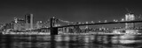 Fototapeta  - Black and white panoramic photo of Brooklyn Bridge at Night, NYC.