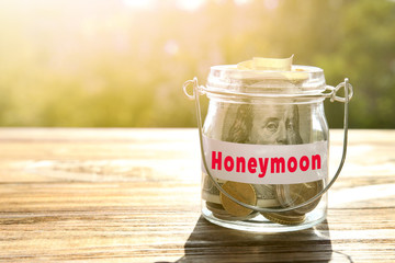 Poster - Glass jar with money on wooden table