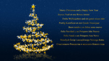Christmas Tree With Glittering Stars On Blue Background, Multilingual Seasons Greetings
