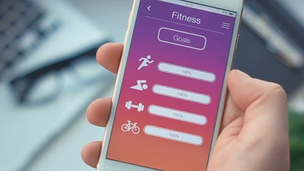 Checking fitness goals on sport app on the smartphone Application
