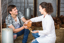 Young Female Doctor Talking To Male Farmer