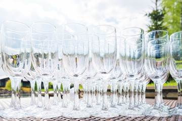 Row of glasses. Table with alcohol beverages for the guests at banquet.