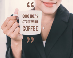 Wall Mural - Inspiration Quote on Beautiful young business woman with smile holding white coffee cup