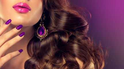 Luxury fashion style, manicure nail , cosmetics and make-up . Jewelry , large purple earrings 