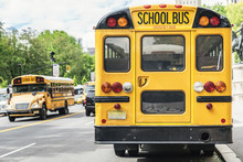 Yellow School Bus In Manhattan Streets.