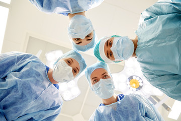 Wall Mural - group of surgeons in operating room at hospital