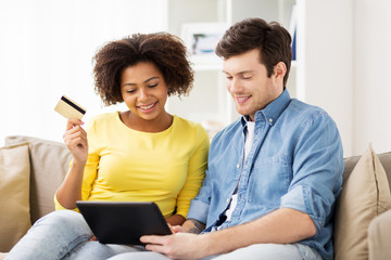 Sticker - couple with tablet pc and credit card at home