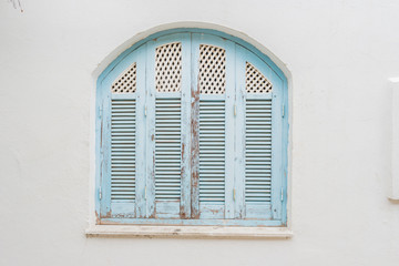 Wall Mural - Traditional old painted door in a historical district or medina, Tunisia. Colorful textured image of muslim architecture.