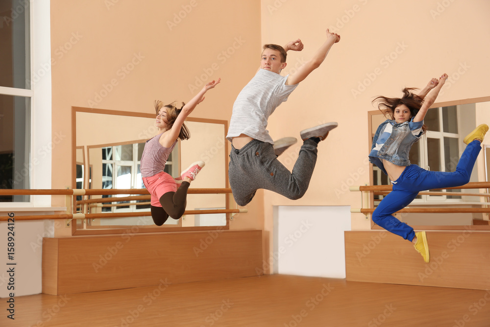 Group of young hip-hop dancers in studio