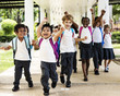 © Rawpixel.com - Group of diverse kindergarten students running cheerful after school