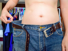 Loose Jeans Because Of Slimming, Weight Loss Concept