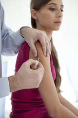 Wall Mural - Vaccinating a woman