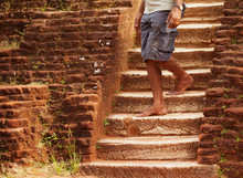 Local Man Walks Down Old Stone Steps. Sri Lanka