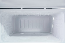 Empty Freezer Of A Refrigerator - Ice Buildup On The Inside Of A Freezer Walls. 