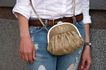  Girl with a vintage bag in the city in summer