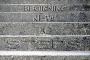 Concrete stairs with text Steps to new beginning