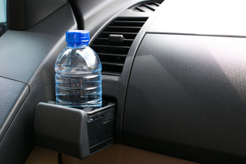 Water bottle placed on the car.