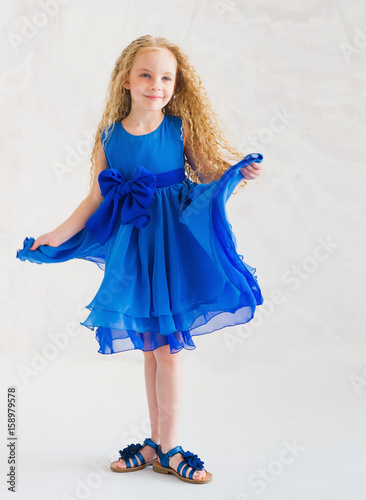 dark girl dressed in blue
