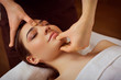 © Studio Romantic - Beautiful woman is given a face massage at the spa salon.
