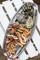 Wall Mural - mixed fresh seafood selection gourmet set platter meal on table