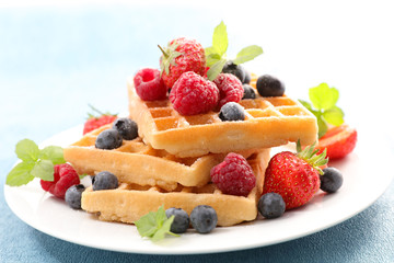 Wall Mural - waffles with berries fruits