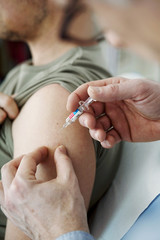 Wall Mural - Vaccinating a man