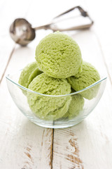 green tea matcha ice cream on white wooden table