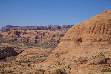 The stone desert on the path to Corona Arch in Arches National Park, Utah 