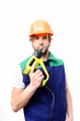 © be free - Builder with serious face expression, orange helmet and construction tool