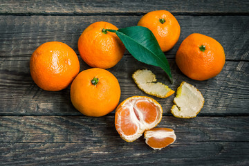 Mandarins on old wooden background