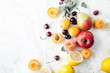 © Anastasiia Nurullina - Summer fruits assorted on white marble background. Fresh raw food concept. Copy space