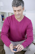© RFBSIP - Man checking his blood glucose level