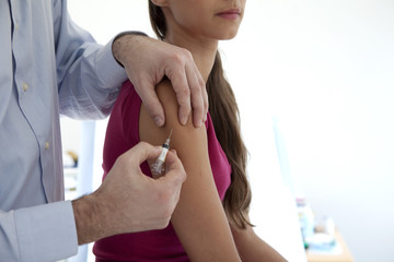 Wall Mural - Vaccinating a woman