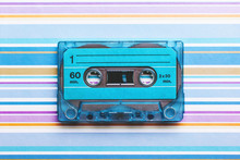 Blue Cassette Tape On Striped And Colored Background