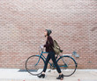 © Good Vibrations Images/Stocksy - Woman with bicycle