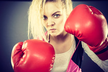 Angry Woman Wearing Boxing Gloves