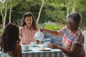 Wall Mural - Happy family having tea