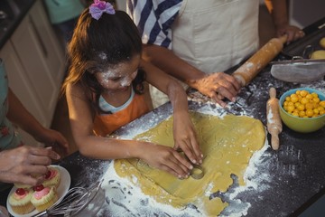 Wall Mural - Family preparing dessert in kitchen